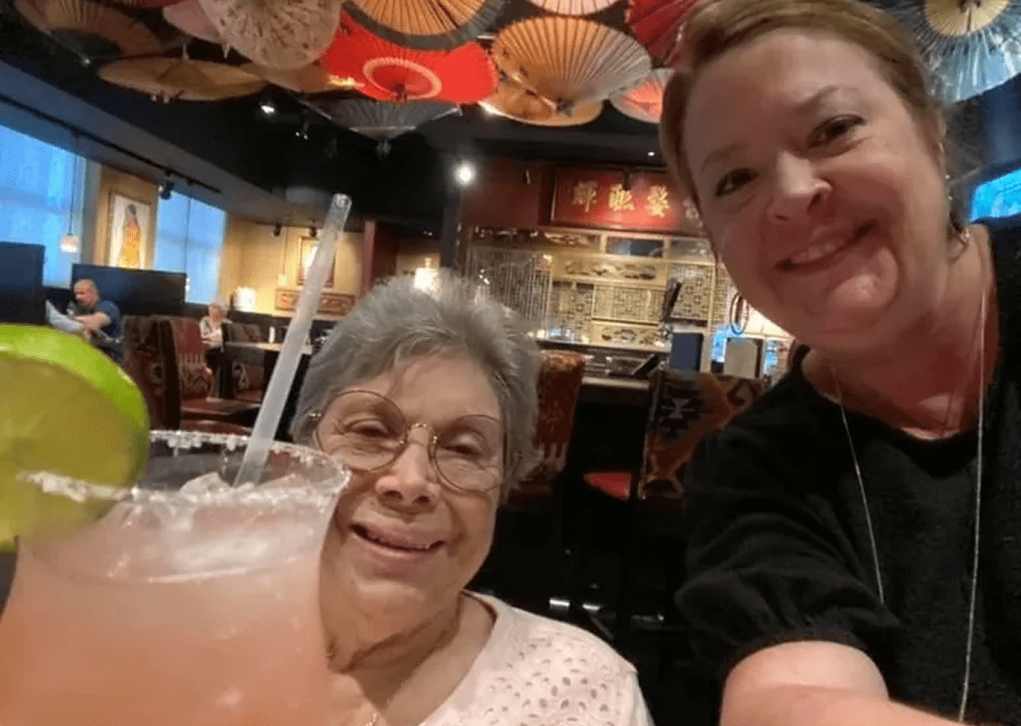 Two women enjoying a drink together