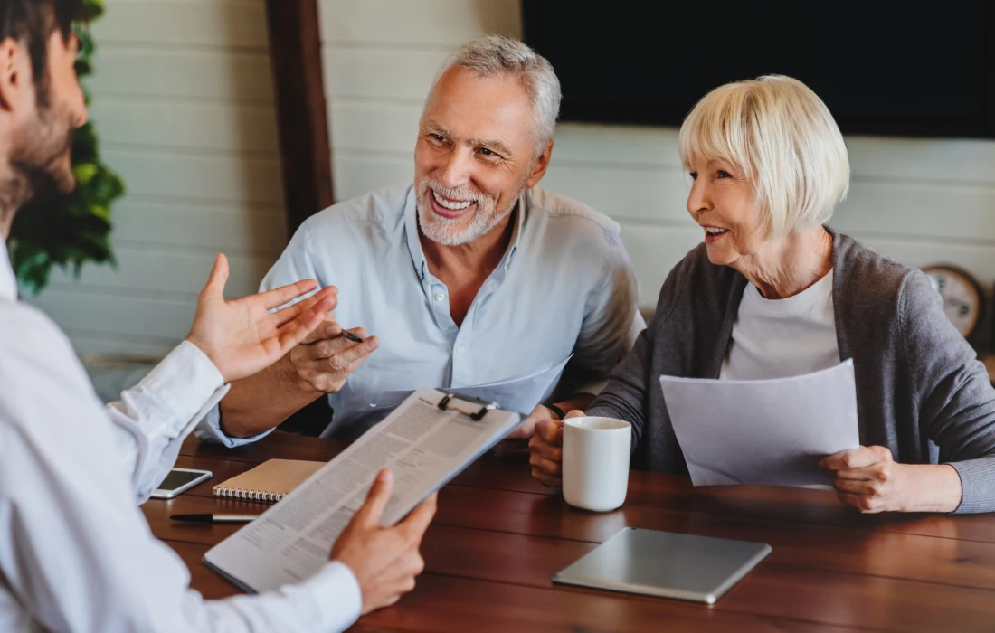 Elderly couple meeting financial consultant
